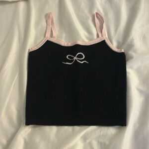 A tank top from pacsun with a bow in pink